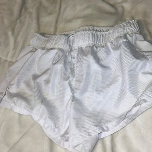 Track shorts. There is a stain on the left side.